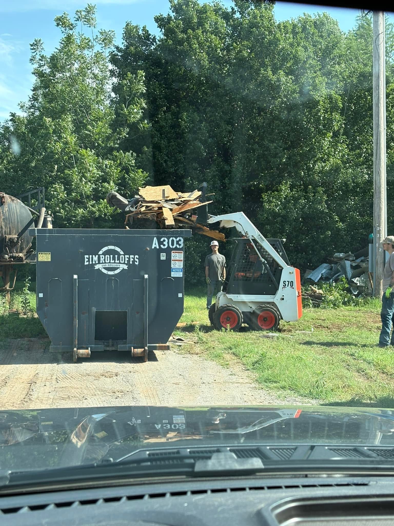 Demolition debris loaded into the roll-off